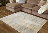 Bay Furniture Gallery - Ashley Furniture - Truward Rug - 8' x 10' Rug / Linen/Gray/Caramel - R406471